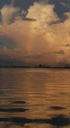 Mary: I ran on the Iconic sidewalk of Bayshore Ave in Tampa, FL.  It was late evening and as I hit the 5k mark I looked over the bay to the east.  I have seen the faint glow of shuttle and space launches from this sidewalk as Cape Canaveral lies almost directly east.  As I looked over I noticed a rainbow formed where I would typically see that faint glow reaching for the stars.  I thought it was a fitting end to my race