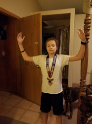 Caleb: First medal, first time walking 1/2 marathon! 11 yrs old