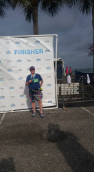 Robin: For buddy Paige. With my medal at the finish of the First Watch Sarasota half marathon