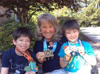 Valli: My grandsons and I each getting our own medals at the same time in Redmond, WA.  Great fun!