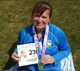 Lorena: "Completed my Aloha 10k on Macinaw Island Lilac Festival 10k. This is honor of you, Grandma Ruby, we love and miss you. :)"